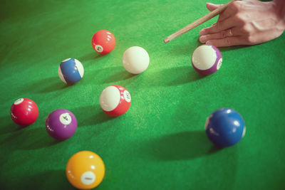 High angle view of person playing with ball on table