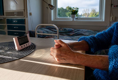 Man holding camera at home