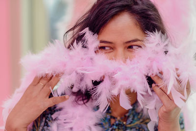 Close-up of woman holding feather