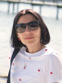 Portrait of young woman wearing sunglasses