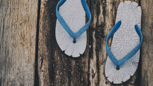 Directly above shot of old flip-flops on table