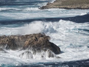 Waves breaking on rocks