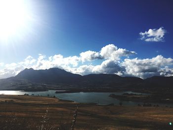 Scenic view of mountains against cloudy sky