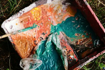 High angle view of paintbrush in container