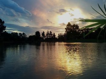 Scenic view of lake against sky during sunset