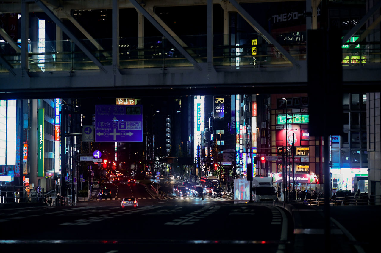 ILLUMINATED CITY STREET AT NIGHT