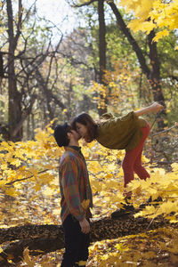 Happy young couple kissing in a park