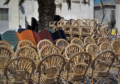 Row of umbrellas for sale in market