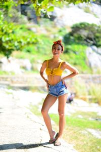 Portrait of a smiling young woman standing outdoors