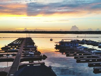 Boats moored at sunset