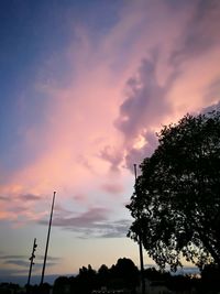 Low angle view of silhouette trees against sky during sunset