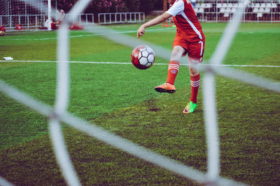 Man playing soccer on field
