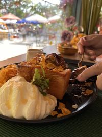 Cropped hand of person preparing food