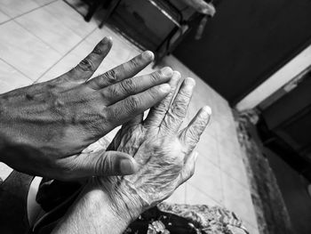 Cropped hands of women at home
