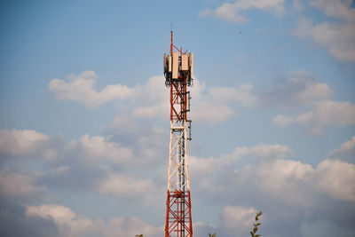 Low angle view of crane against sky