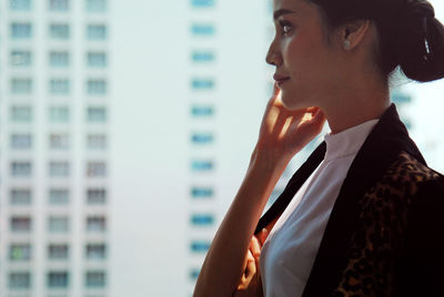 Portrait of a young woman looking away