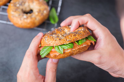 Close-up of hand holding burger