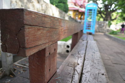 Close-up of rusty metal on footpath