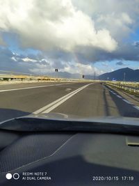 Road seen through car windshield