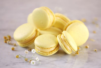 Close-up of macarons fruits on table