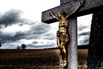 Low angle view of statue against sky
