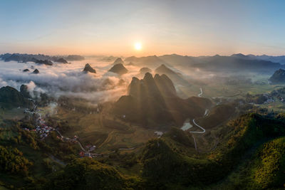 Scenic view of mountains against sky during sunset