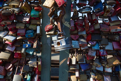 Padlocks hanging on railing