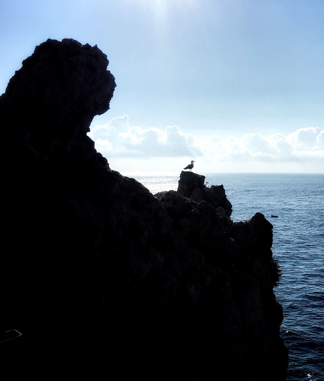 SCENIC VIEW OF ROCK FORMATION ON BEACH AGAINST SKY