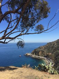 Scenic view of sea against blue sky