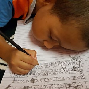 Close-up of boy holding book