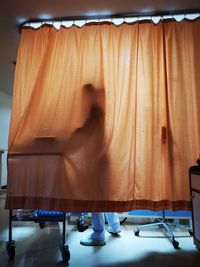 Blurred motion of woman sitting on seat