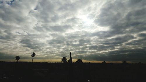 Silhouette of landscape against dramatic sky