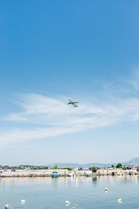 Airplane flying over blue sky