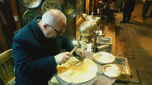 High angle view of man preparing food