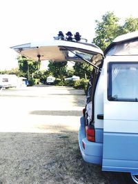 Car on road against sky in city
