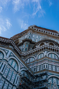 Low angle view of ornate building against sky