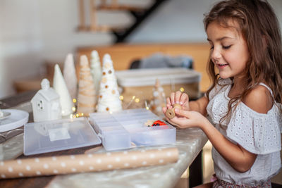 Cute girl holding table