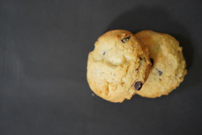 High angle view of cookies against black background