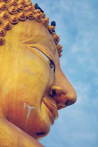 Low angle view of statue against sky