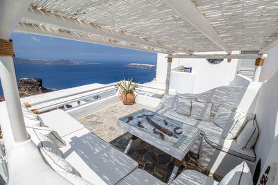 Aerial view of swimming pool by sea against sky