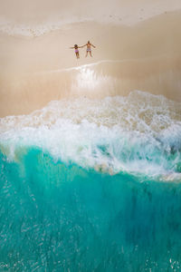 High angle view of man surfing in sea