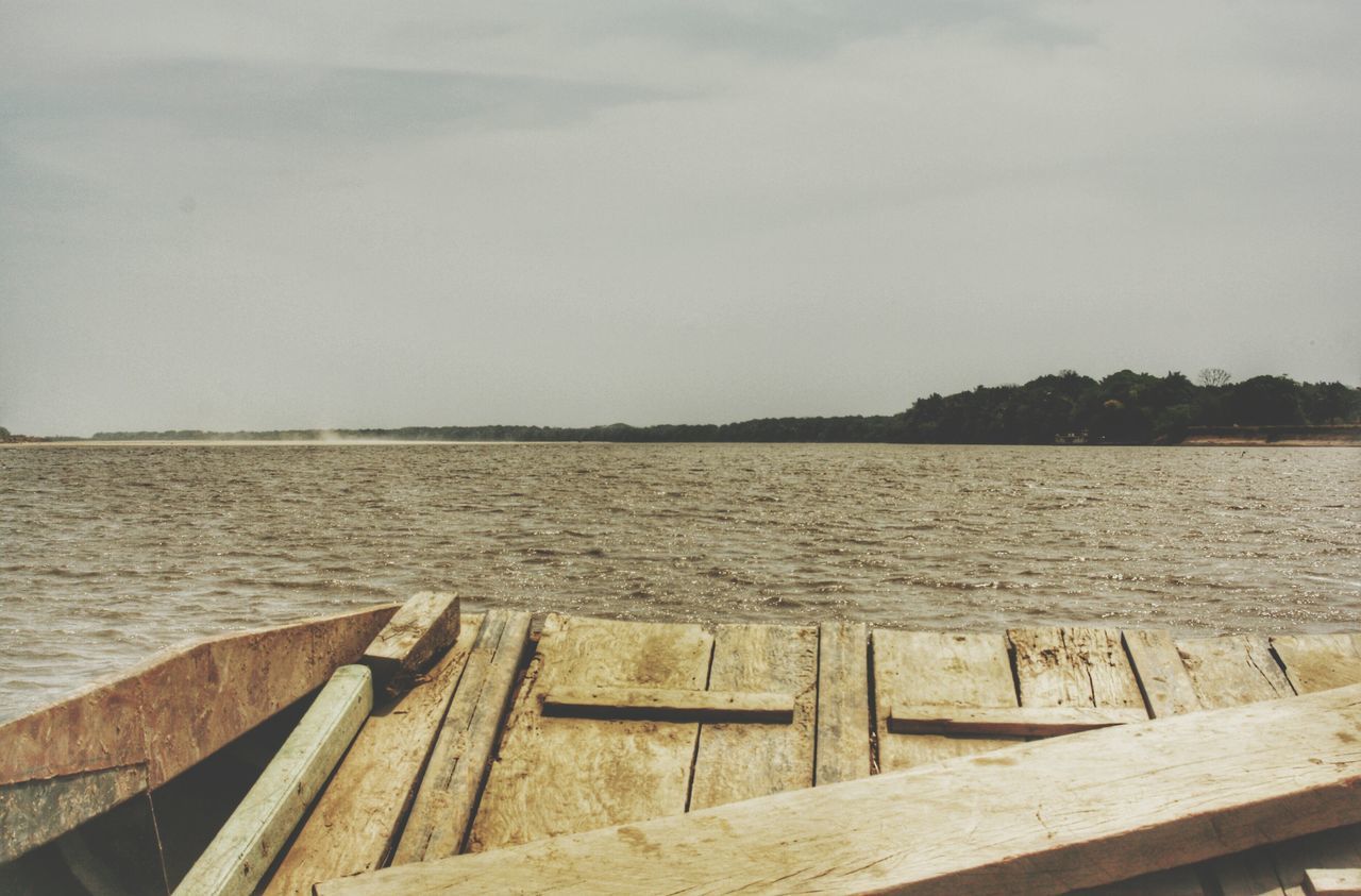 water, pier, tranquil scene, sea, tranquility, sky, wood - material, scenics, railing, jetty, nature, beauty in nature, the way forward, wood, rippled, boardwalk, idyllic, lake, wooden, day