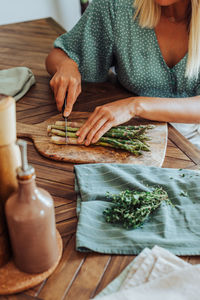 High angle view of woman sitting on table