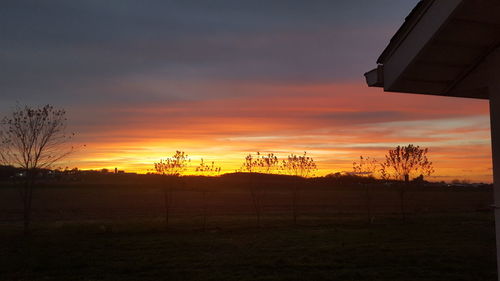 Scenic view of landscape against sky at sunset
