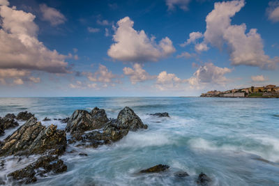 Scenic view of sea against cloudy sky