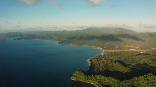 Aerial view coastline of tropical island and sea at sunrise. el nido, palawan, philippines. 