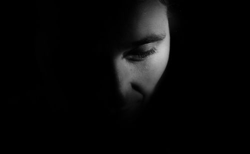 Close-up of woman in darkroom