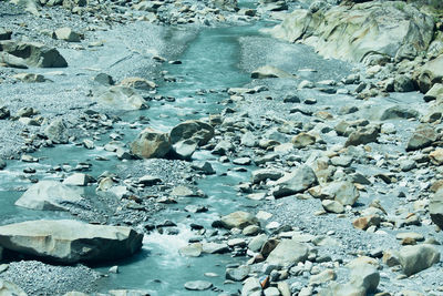 High angle view of pebbles on beach