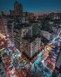 High angle view of illuminated buildings in city at night, sham shui po, hong kong. 