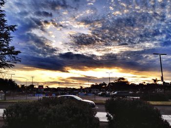 Road against cloudy sky at sunset